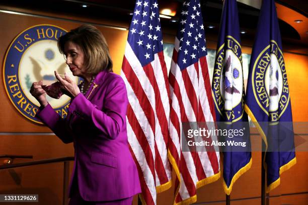 Speaker of the House Rep. Nancy Pelosi puts her mask on as she leaves after a weekly news conference at the U.S. Capitol July 28, 2021 in Washington,...