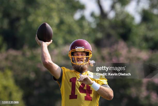 Ryan Fitzpatrick of the Washington Football Team passes during the Washington Football Team training camp on July 28, 2021 in Richmond, Virginia.