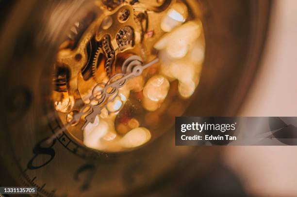 gold color antique watch mechanism working - clockworks stock pictures, royalty-free photos & images
