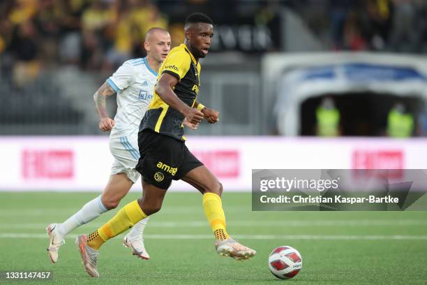 Jordan Siebatcheu Pefok of BSC Young Boys controls the ball whilst under pressure of Vladimir Weiss of SK Slovan Bratislava during the UEFA Champions...