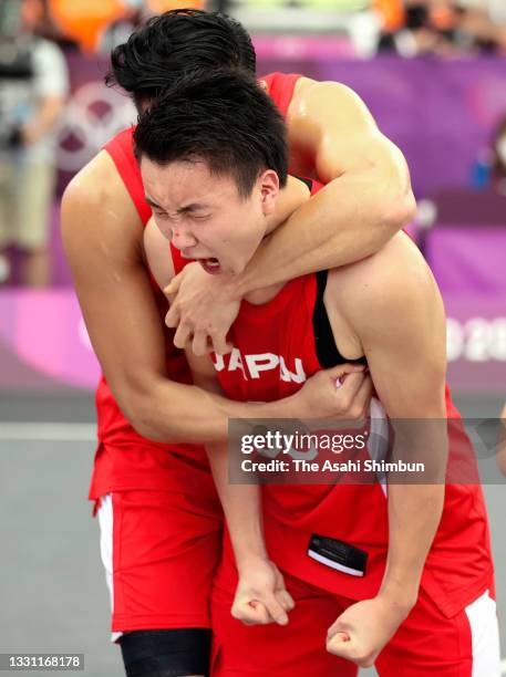Tomoya Ochiai and Keisei Tominaga of Team Japan celebrate their victory in the Men's 3x3 Pool Round match between China and Japan on day four of the...