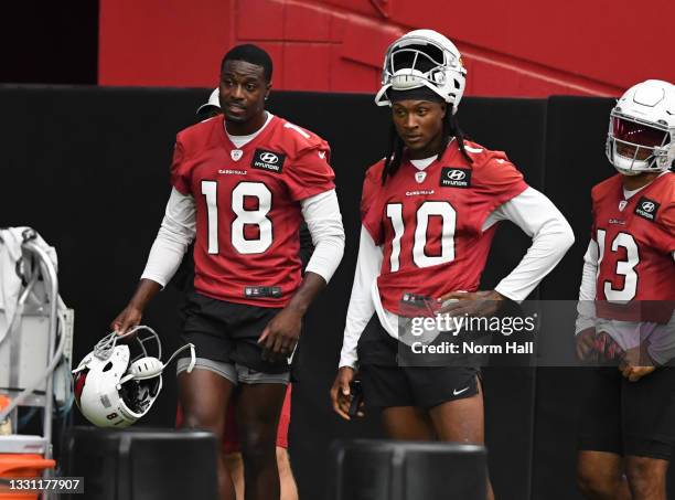 DeAndre Hopkins and A.J. Green of the Arizona Cardinals look on during passing drills at Training Camp at State Farm Stadium on July 28, 2021 in...
