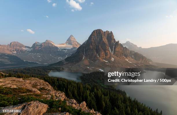 scenic view of mountains against sky,mount assiniboine,canada - mt assiniboine stock-fotos und bilder