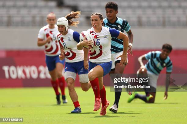 Fanny Horta of Team France breaks away to score a try in the Women’s pool B match between Team France and Team Fiji during the Rugby Sevens on day...