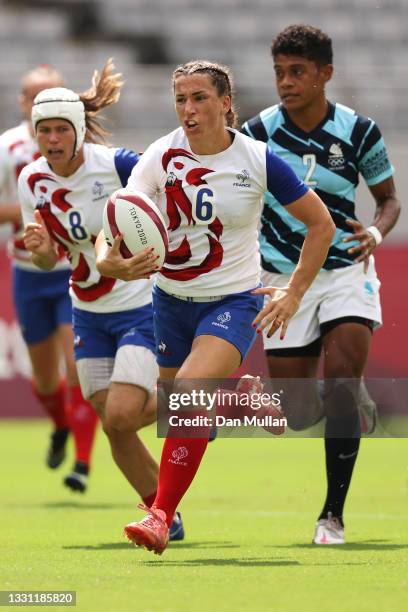 Fanny Horta of Team France breaks away to score a try in the Women’s pool B match between Team France and Team Fiji during the Rugby Sevens on day...