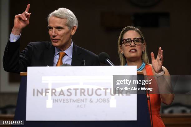 Sen. Rob Portman and Sen. Kyrsten Sinema answer questions from members of the press during a news conference after a procedural vote for the...