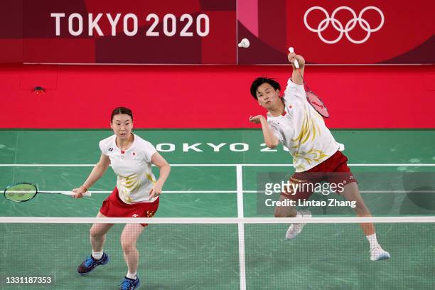 Yuta Watanabe and Arisa Higashino of Team Japan compete against Wang Yi Lyu and Huang Dong Ping of Team China during a Mixed Doubles Semi-final match...