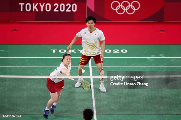 Yuta Watanabe and Arisa Higashino of Team Japan compete against Wang Yi Lyu and Huang Dong Ping of Team China during a Mixed Doubles Semi-final match...