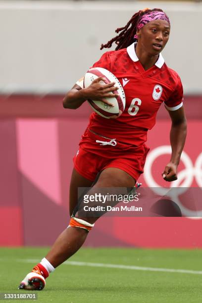 Charity Williams of Team Canada breaks away to score a try in the Women’s pool B match between Team Canada and Team Brazil during the Rugby Sevens on...