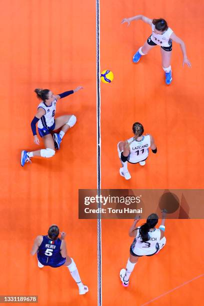 Team Italy battles at the net against Team Argentina during the Women's Preliminary - Pool B volleyball on day six of the Tokyo 2020 Olympic Games at...