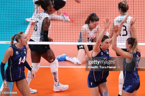 Raphaela Folie of Team Italy celebrates with Alessia Orro after a play against Team Argentina during the Women's Preliminary - Pool B volleyball on...