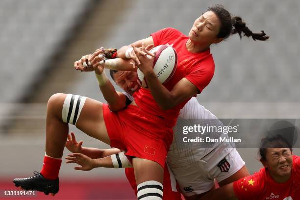 Min Yang of Team China wins the ball over Abby Gustaitis of Team United States in the Women’s pool C match between Team United States and Team China...