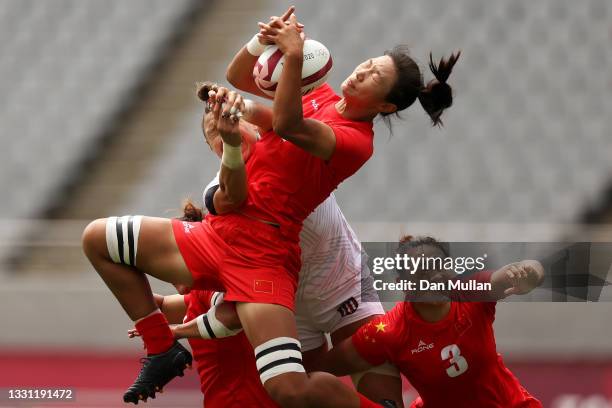 Min Yang of Team China wins the ball over Abby Gustaitis of Team United States in the Women’s pool C match between Team United States and Team China...