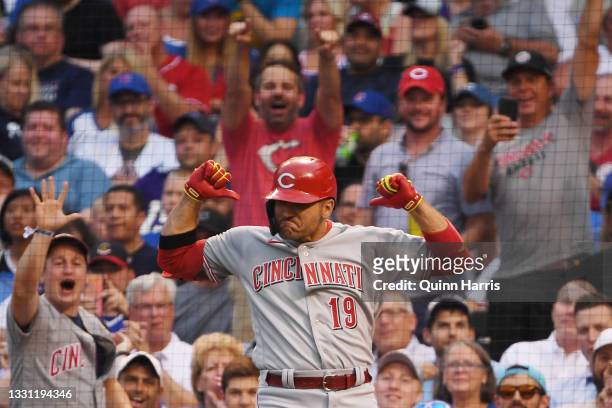 Joey Votto of the Cincinnati Reds celebrates after his home run in the second inning against the Chicago Cubs at Wrigley Field on July 28, 2021 in...