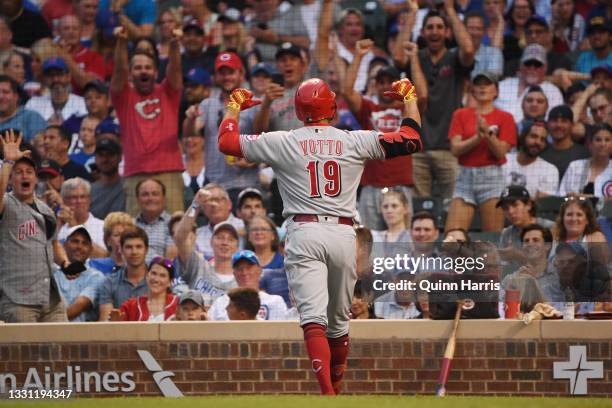 Joey Votto of the Cincinnati Reds celebrates after his home run in the second inning against the Chicago Cubs at Wrigley Field on July 28, 2021 in...