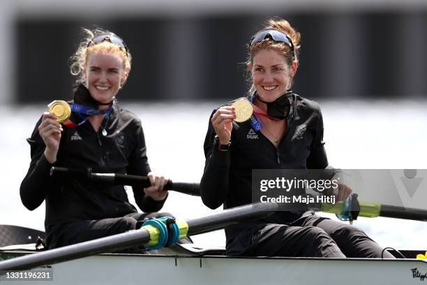 Gold medalists Grace Prendergast and Kerri Gowler of Team New Zealand pose with their medals in their boat after the Women's Pair Final A on day six...