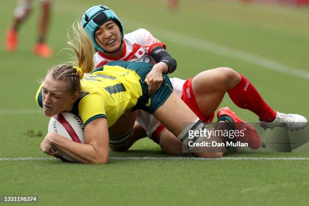 Maddison Levi of Team Australia scores a try in the Women’s pool C match between Team Australia and Team Japan during the Rugby Sevens on day six of...