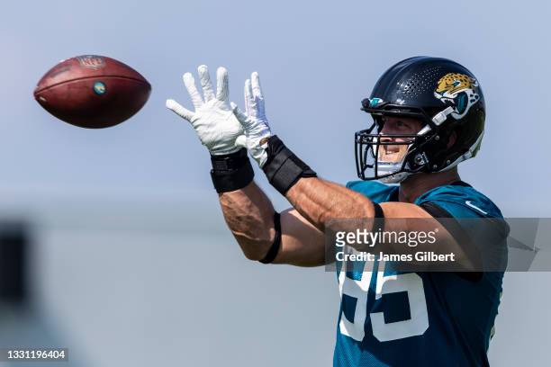 Tim Tebow of the Jacksonville Jaguars catches a pass during training camp at TIAA Bank Field on July 28, 2021 in Jacksonville, Florida.