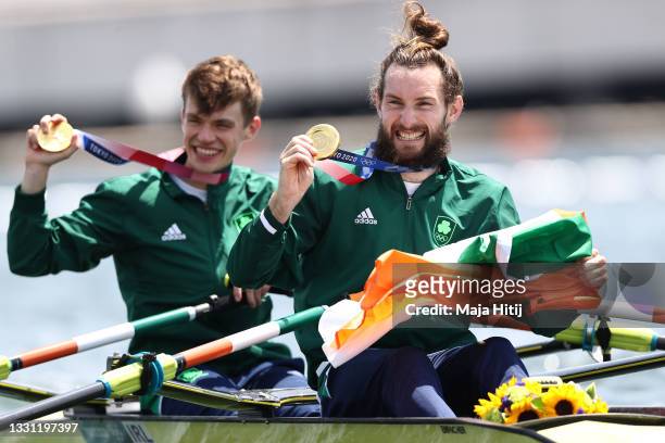 Gold medalists Fintan Mccarthy and Paul O'Donovan of Team Ireland pose with their medals in their boat after the Lightweight Men's Double Sculls...