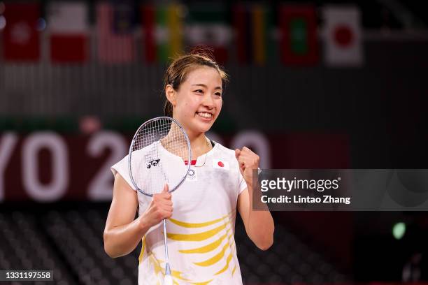 Nozomi Okuhara of Team Japan celebrates after her victory against Michelle Li of Team Canada during a Women's Singles Round of 16 match on day six of...