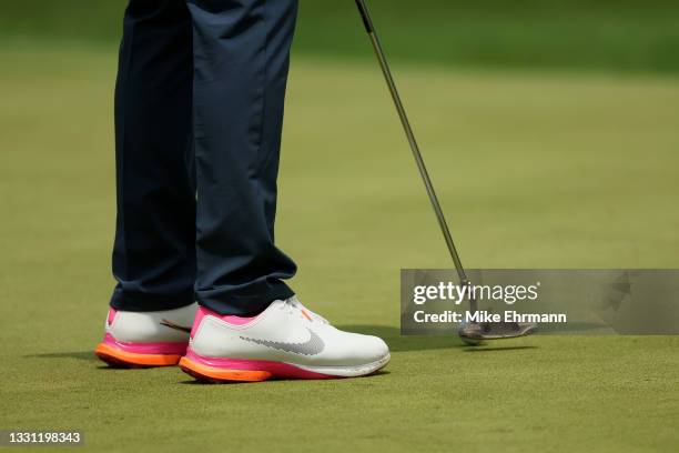 Detailed view of shoes worn by Rory McIlroy of Team Ireland are seen as he putts on the third green during the first round of the Men's Individual...