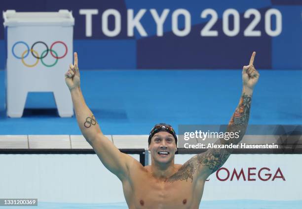 Caeleb Dressel of Team United States reacts after winning the gold medal in the Men's 100m Freestyle Final on day six of the Tokyo 2020 Olympic Games...