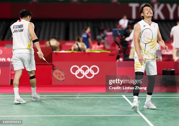 Takeshi Kamura and Keigo Sonoda of Team Japan react as they compete against Mohammad Ahsan and Hendra Setiawan of Team Indonesia during a Men’s...