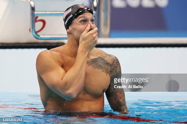 Caeleb Dressel of Team United States reacts after winning the gold medal in the Men's 100m Freestyle Final on day six of the Tokyo 2020 Olympic Games...
