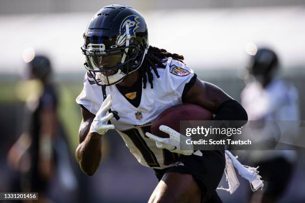 Deon Cain of the Baltimore Ravens in action during training camp at Under Armour Performance Center Baltimore Ravens on July 28, 2021 in Owings...