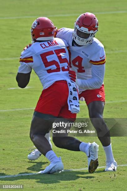 Defensive ends Taco Charlton and Frank Clark of the Kansas City Chiefs run blocking drills, during training camp at Missouri Western State University...