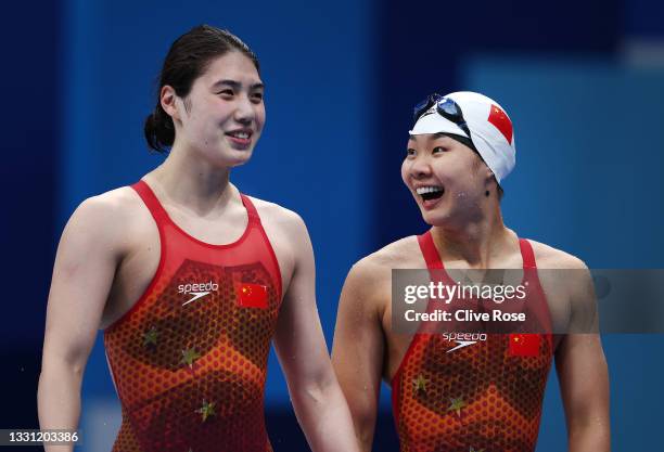 Yufei Zhang and Liyan Yu of Team China react after competing in the Women's 200m Butterfly Final on day six of the Tokyo 2020 Olympic Games at Tokyo...