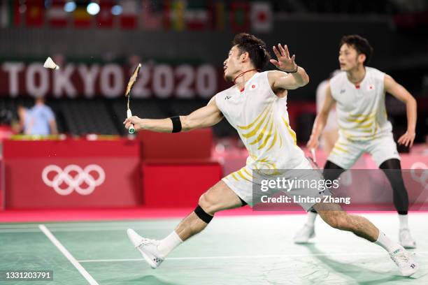 Takeshi Kamura and Keigo Sonoda of Team Japan compete against Mohammad Ahsan and Hendra Setiawan of Team Indonesia during a Men’s Doubles...
