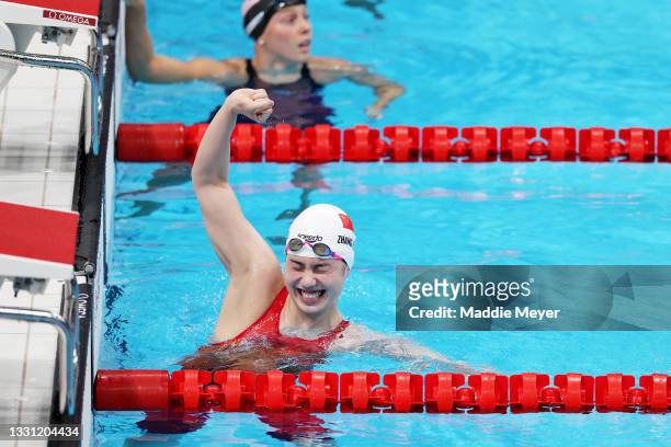 Yufei Zhang of Team China celebrates winning the gold medal and breaking the olympic record in the Women's 200m Butterfly Final on day six of the...