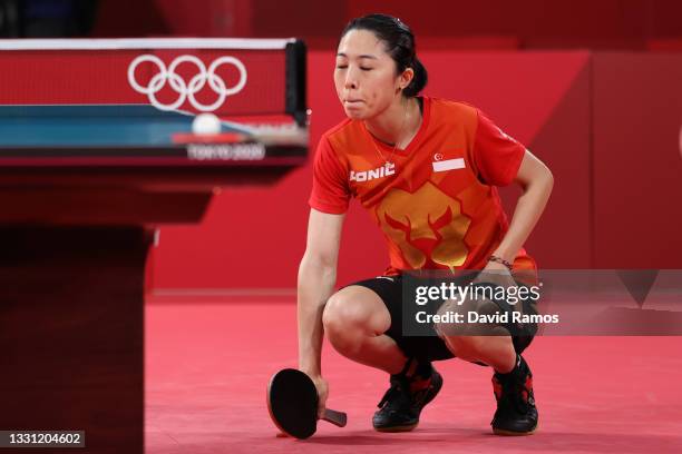 Yu Mengyu of Team Singapore squats down after suffering an injury during her Women's Singles Semifinals match on day six of the Tokyo 2020 Olympic...