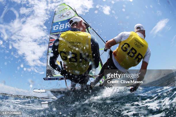 Dylan Fletcher and Stuart Bithell of Team Great Britain head out onto the water to compete in the Men's Skiff 49er class on day six of the Tokyo 2020...