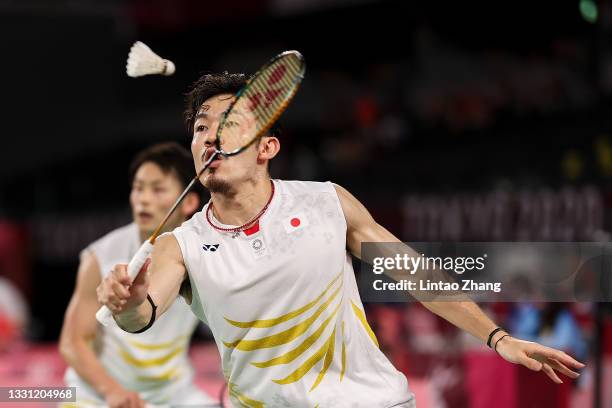 Takeshi Kamura and Keigo Sonoda of Team Japan react as they compete against Mohammad Ahsan and Hendra Setiawan of Team Indonesia during a Men’s...