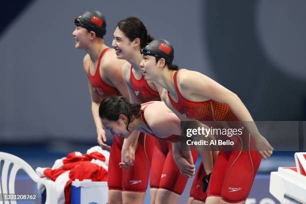 Junxuan Yang, Muhan Tang, Yufei Zhang and Bingjie Li of Team China react after winning the gold medal in the Women's 4 x 200m Freestyle Relay Final...