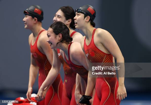 Junxuan Yang, Muhan Tang, Yufei Zhang and Bingjie Li of Team China react after winning the gold medal in the Women's 4 x 200m Freestyle Relay Final...