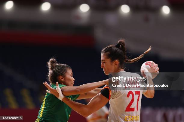 Lara Gonzalez Ortega of Team Spain is challenged by Adriana Cardoso of Team Brazil during the Women's Preliminary Round Group B handball match...