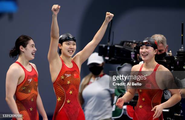Junxuan Yang, Muhan Tang and Yufei Zhang of Team China react after winning the gold medal in the Women's 4 x 200m Freestyle Relay Final on day six of...