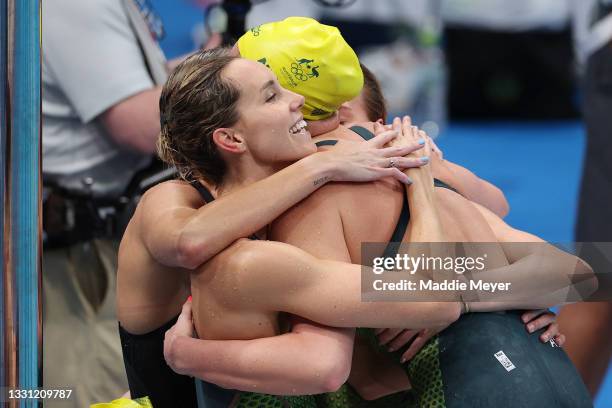 Emma McKeon of Team Australia embraces Leah Neale of Team Australia after winning the bronze medal in the Women's 4 x 200m Freestyle Relay Final on...