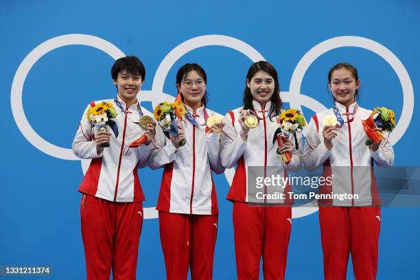 Gold medalist Junxuan Yang, Yufei Zhang, Bingjie Li and Muhan Tang of Team China poses with the gold medal for the Women's 4 x 200m Freestyle Relay...