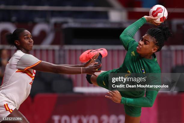 Bruna de Paula of Team Brazil shoots and scores a goal as Alexandrina Cabral Barbosa of Team Spain attempts to defend during the Women's Preliminary...