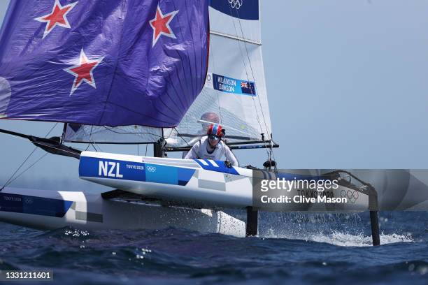 Micah Wilkinson and Erica Dawson of Team New Zealand compete in the Nacra 17 Foiling class race on day six of the Tokyo 2020 Olympic Games at...