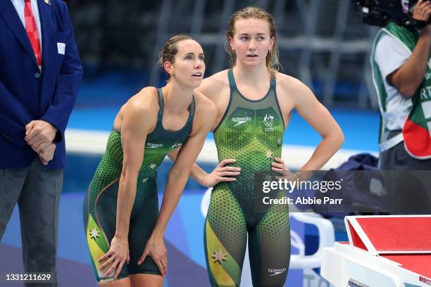 Emma McKeon and Ariarne Titmus of Team Australia react during the Women's 4X200 meter freestyle relay final on day six of the Tokyo 2020 Olympic...