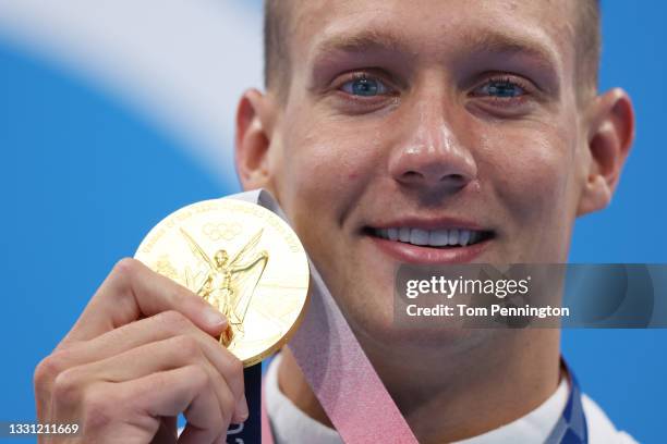 Gold medalist Caeleb Dressel of Team United States poses with the gold medal for the Men's 100m Freestyle Final on day six of the Tokyo 2020 Olympic...