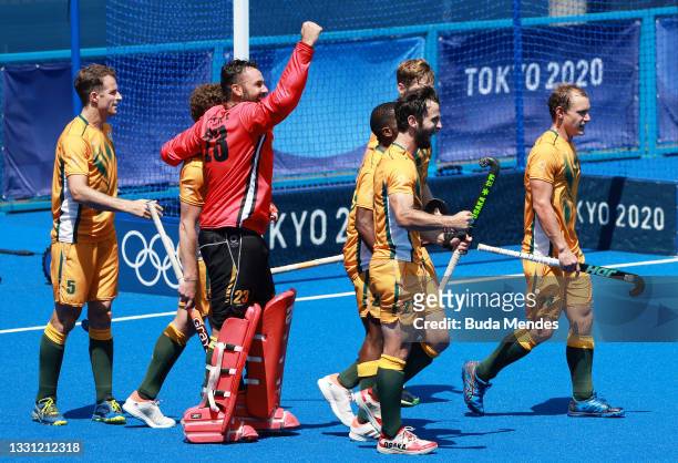 Austin Charles Smith, Taine Pieterse and Jethro Ray Eustice of Team South Africa celebrate their 4-3 win against Team Germany with teammates after...