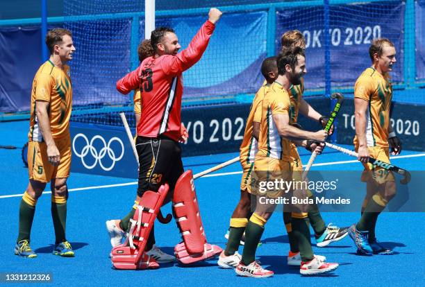 Austin Charles Smith, Taine Pieterse and Jethro Ray Eustice of Team South Africa celebrate their 4-3 win against Team Germany with teammates after...