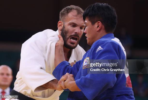 Karl-Richard Frey of Team Germany and Guham Cho of Team Republic of Korea compete during the Men’s Judo 100kg Quarterfinal on day six of the Tokyo...