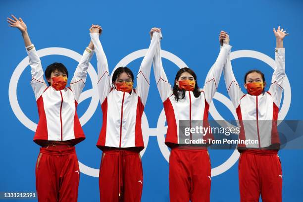 Gold medalist Junxuan Yang, Yufei Zhang, Bingjie Li and Muhan Tang of Team China pose with their gold medals for the Women's 4 x 200m Freestyle Relay...